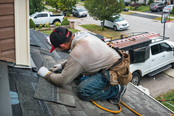Professional Roofing technician working in Leland, IA